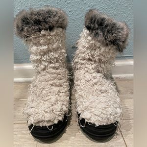 Free People Ugg style with yarn fringe.